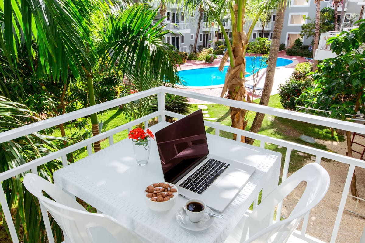 Deluxe Studio, 1 Bedroom, Garden View, Poolside | 1 bedroom, in-room safe, desk, laptop workspace