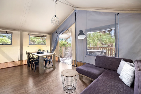 Deluxe Tent | Living area | Flat-screen TV