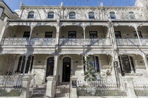 Classic architecture with ornate balconies and symmetrical facade.