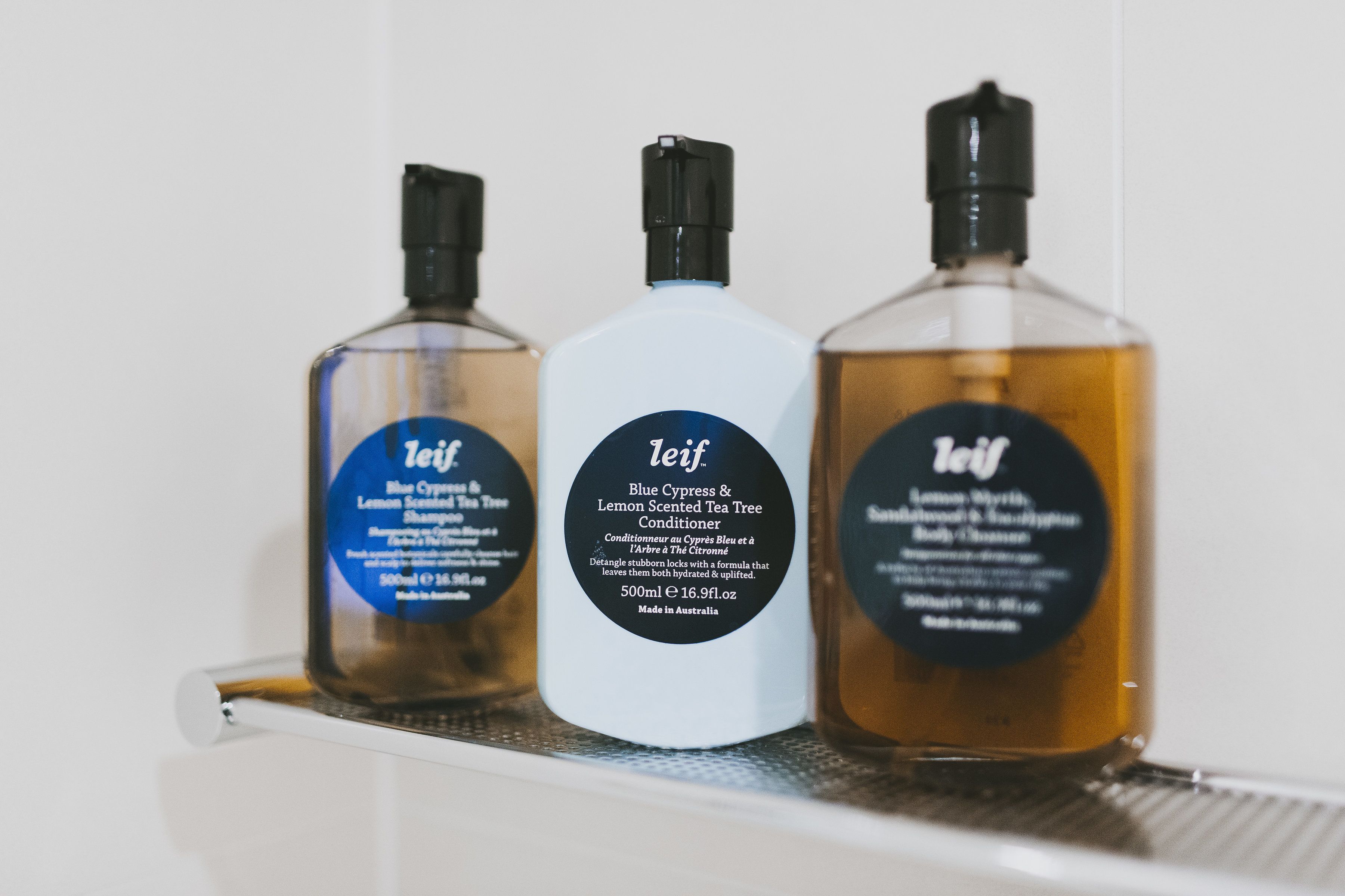 designer toiletries, hair dryer, bathrobes, slippers