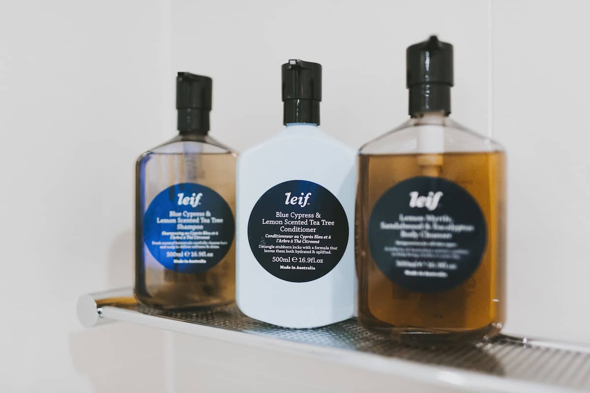 designer toiletries, hair dryer, bathrobes, slippers