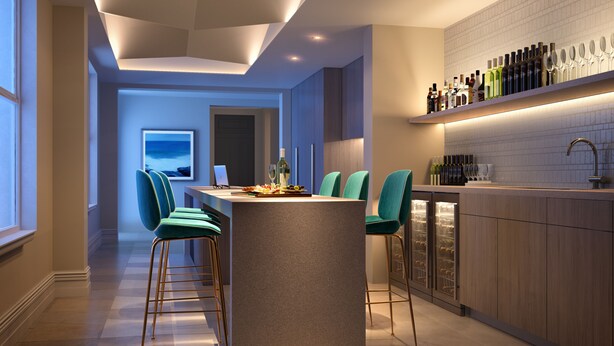 A modern kitchen with a bar area, green chairs, and a wine cooler. - Spicers Potts Point (Potts Point)