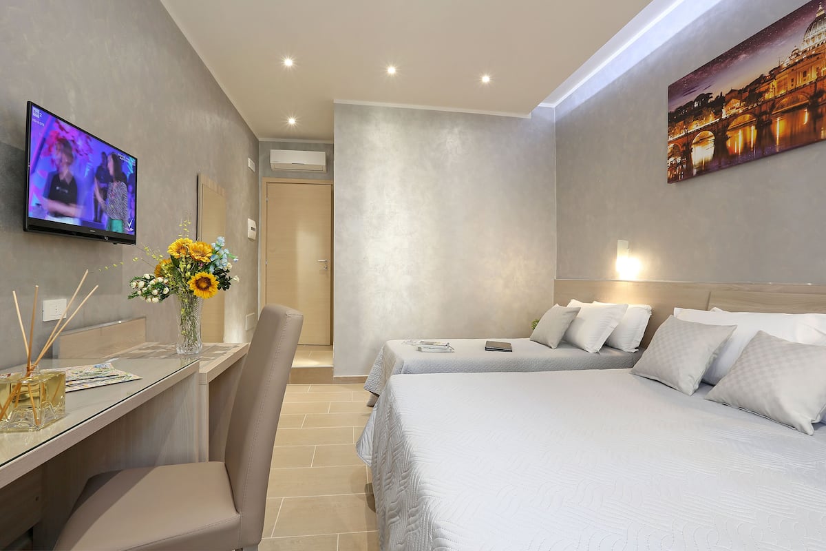 Triple Room, City View | Minibar, in-room safe, desk, soundproofing