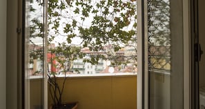 Enjoy the serene view of the surrounding residential area from this balcony.