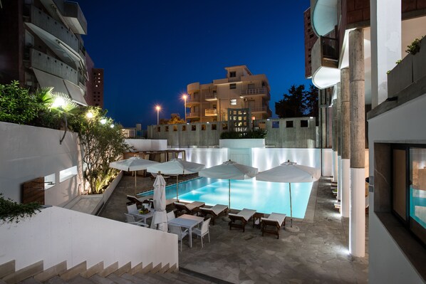 Seasonal outdoor pool, pool umbrellas, pool loungers