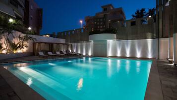 Seasonal outdoor pool, pool umbrellas, sun loungers