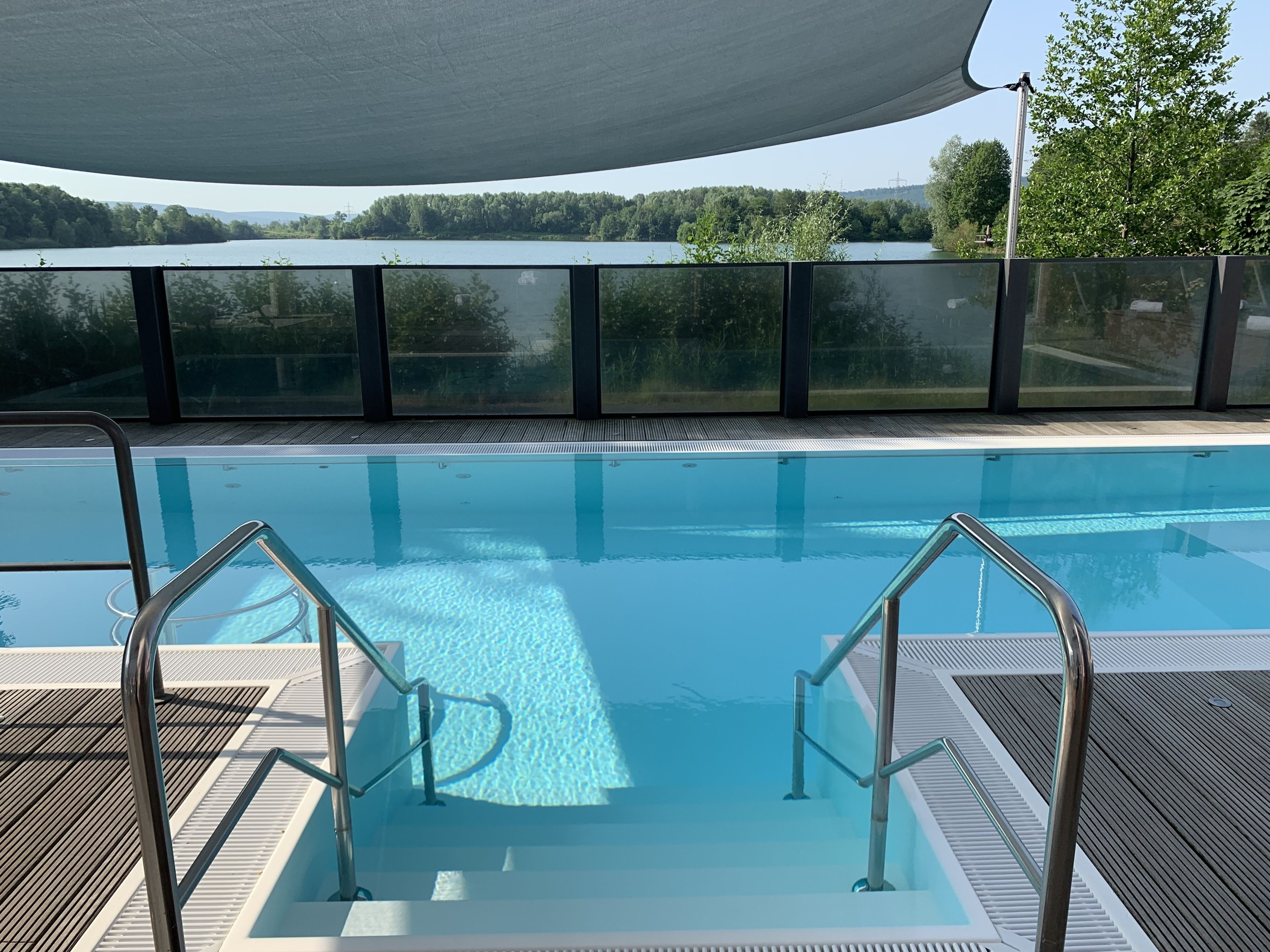 indoor pool, outdoor pool, pool umbrellas, pool loungers