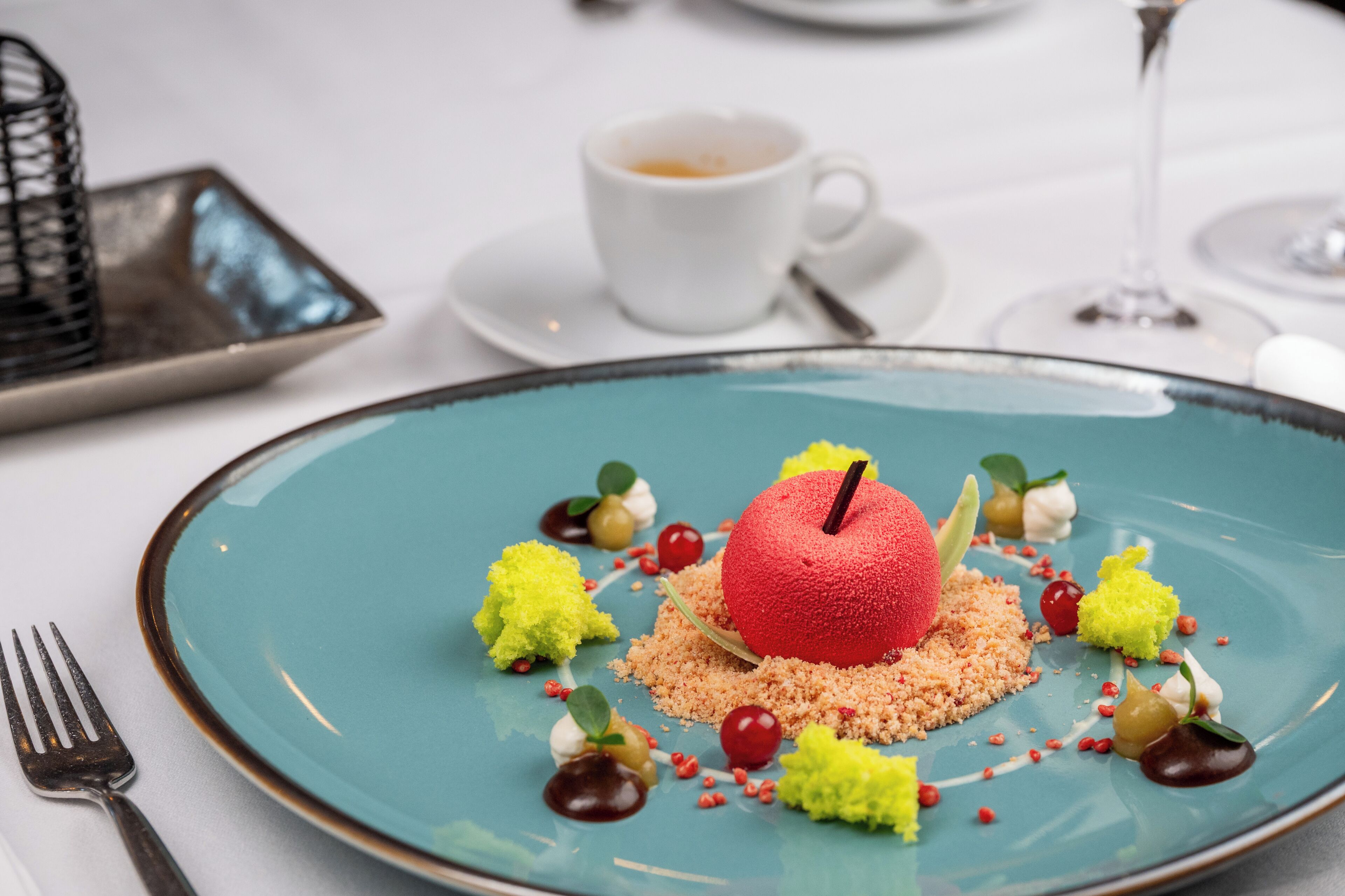 A dessert on a plate with a fork beside it.