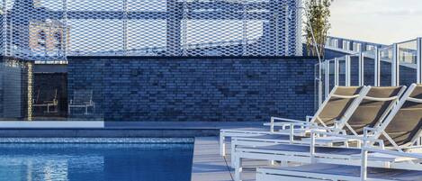 Seasonal outdoor pool, open 9:00 AM to 8:00 PM, sun loungers