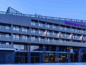 A modern hotel with a metal facade, multiple balconies, and a prominent 'Mercure Hotel' sign. - Mercure Blankenberge (Blankenberge)