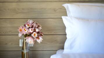 A wooden wall and a white sofa.