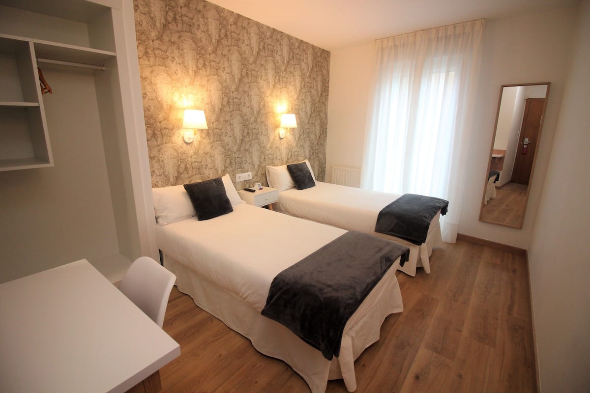 Premium bedding, desk, blackout curtains, iron/ironing board