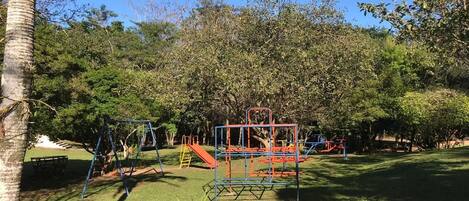 A playground with swings, slides, and climbing structures.