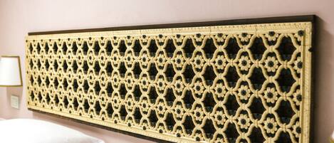 A wall-mounted decorative panel with a geometric pattern.