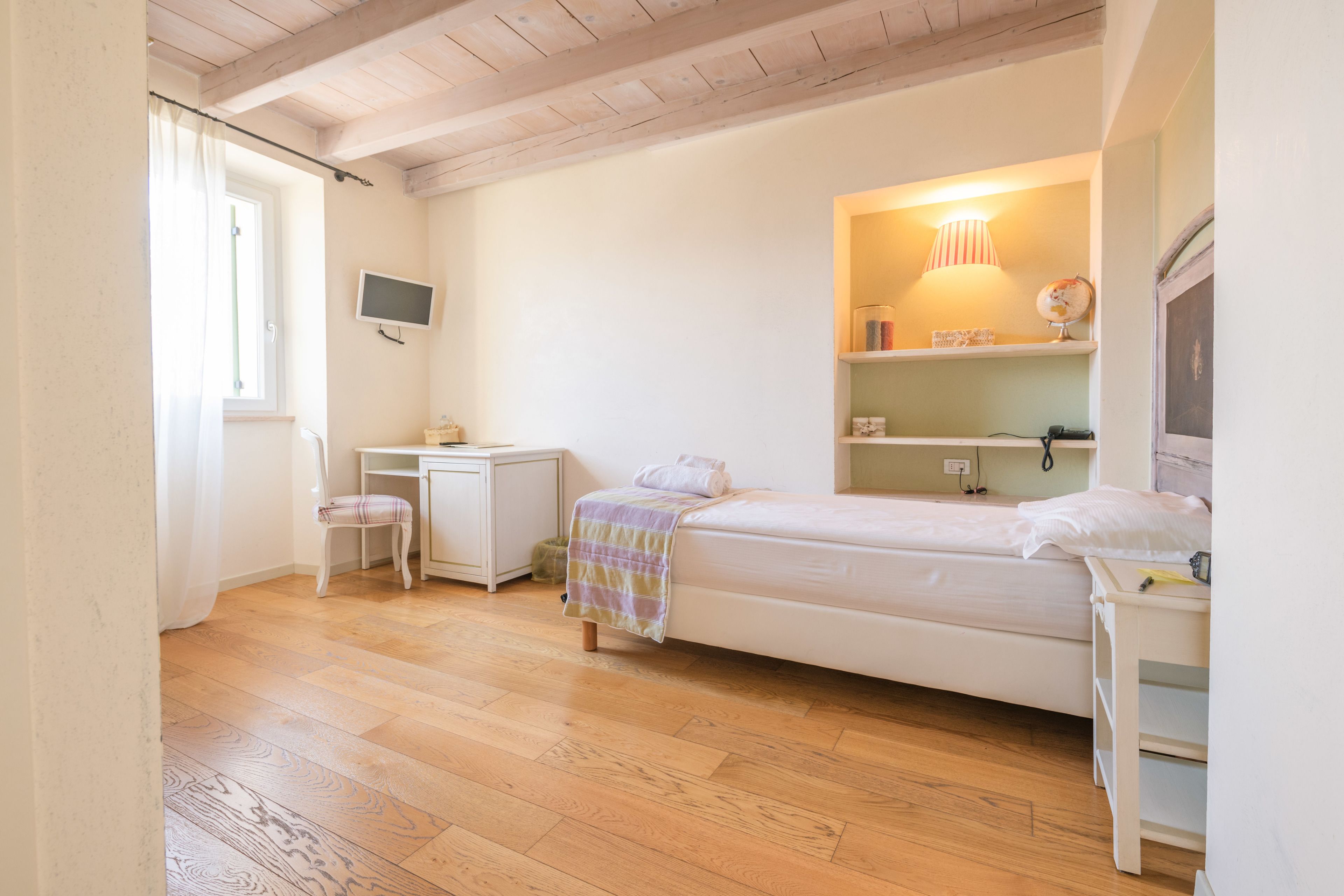 single room | in-room safe, individually decorated, desk, blackout curtains