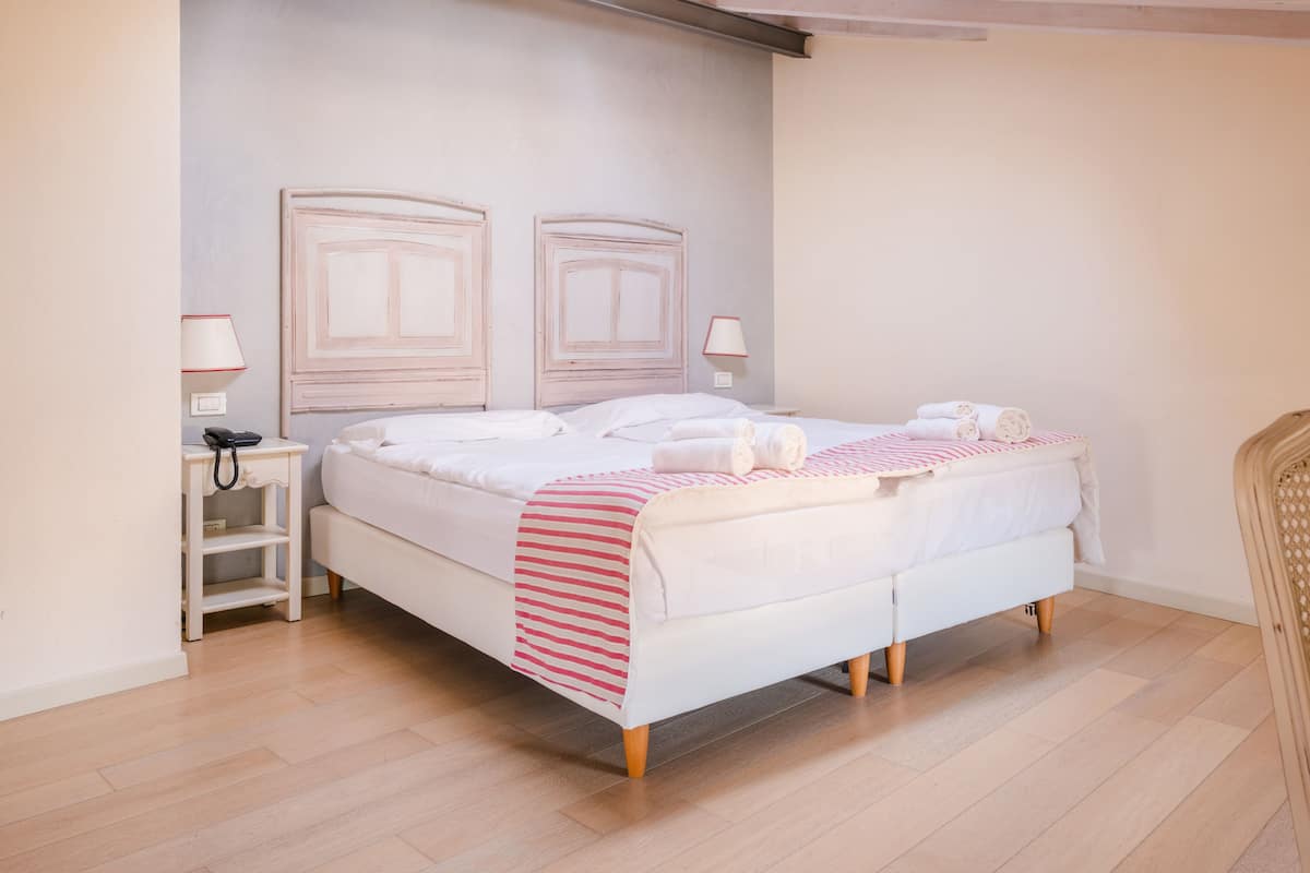 Standard Quadruple Room, 1 Bedroom | In-room safe, desk, blackout drapes, WiFi (free)