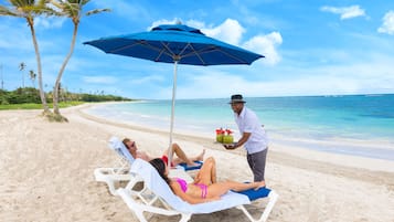 On the beach, sun loungers, beach umbrellas, beach towels