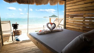 On the beach, sun-loungers, beach umbrellas, beach towels