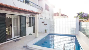 Outdoor pool, open 8 AM to midnight, pool umbrellas, sun loungers