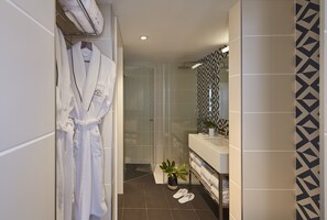 Designer toiletries, hair dryer, bathrobes, slippers
