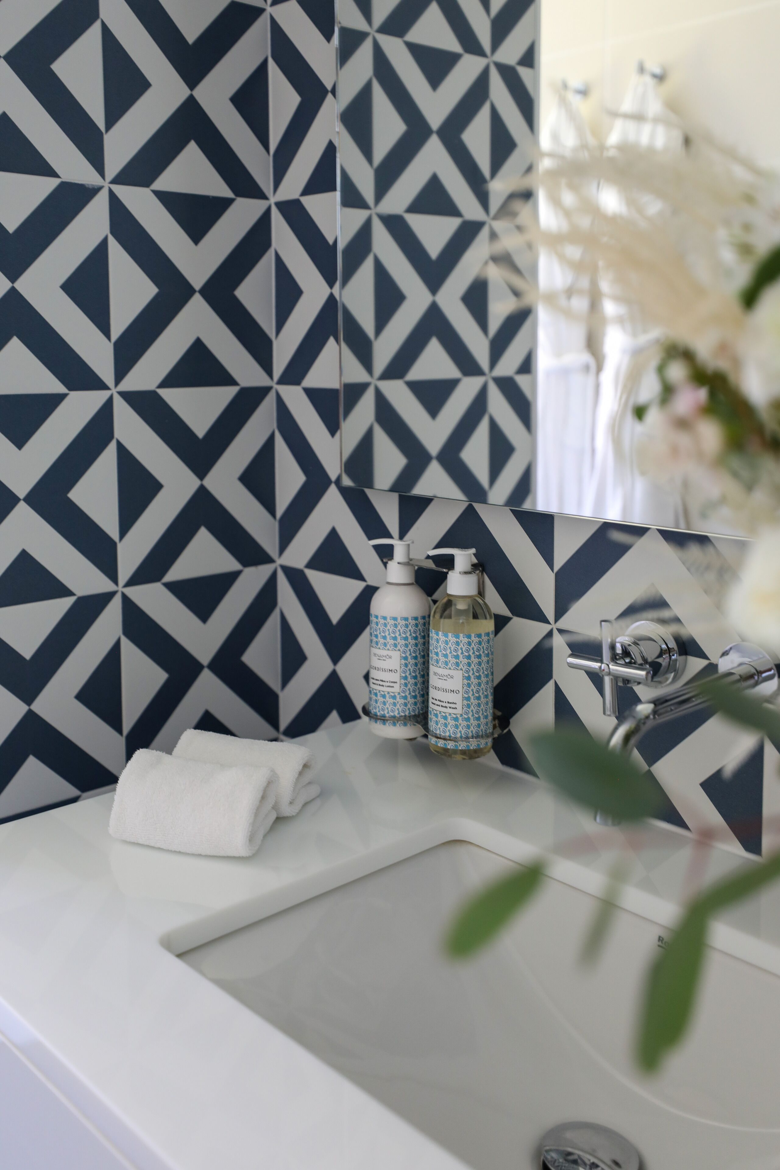 designer toiletries, hair dryer, bathrobes, slippers