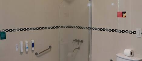 A bathroom with a bathtub, a bidet, and a toilet.
