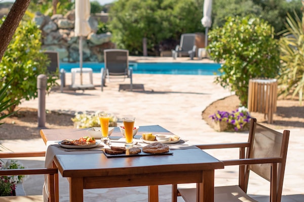 Outdoor pool, pool umbrellas, sun loungers