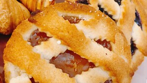 A tray of pastries, including croissants and fruit-filled pastries. - B&B Dimora Cirillo (Naples)