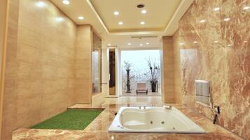 Separate tub and shower, rainfall showerhead, free toiletries