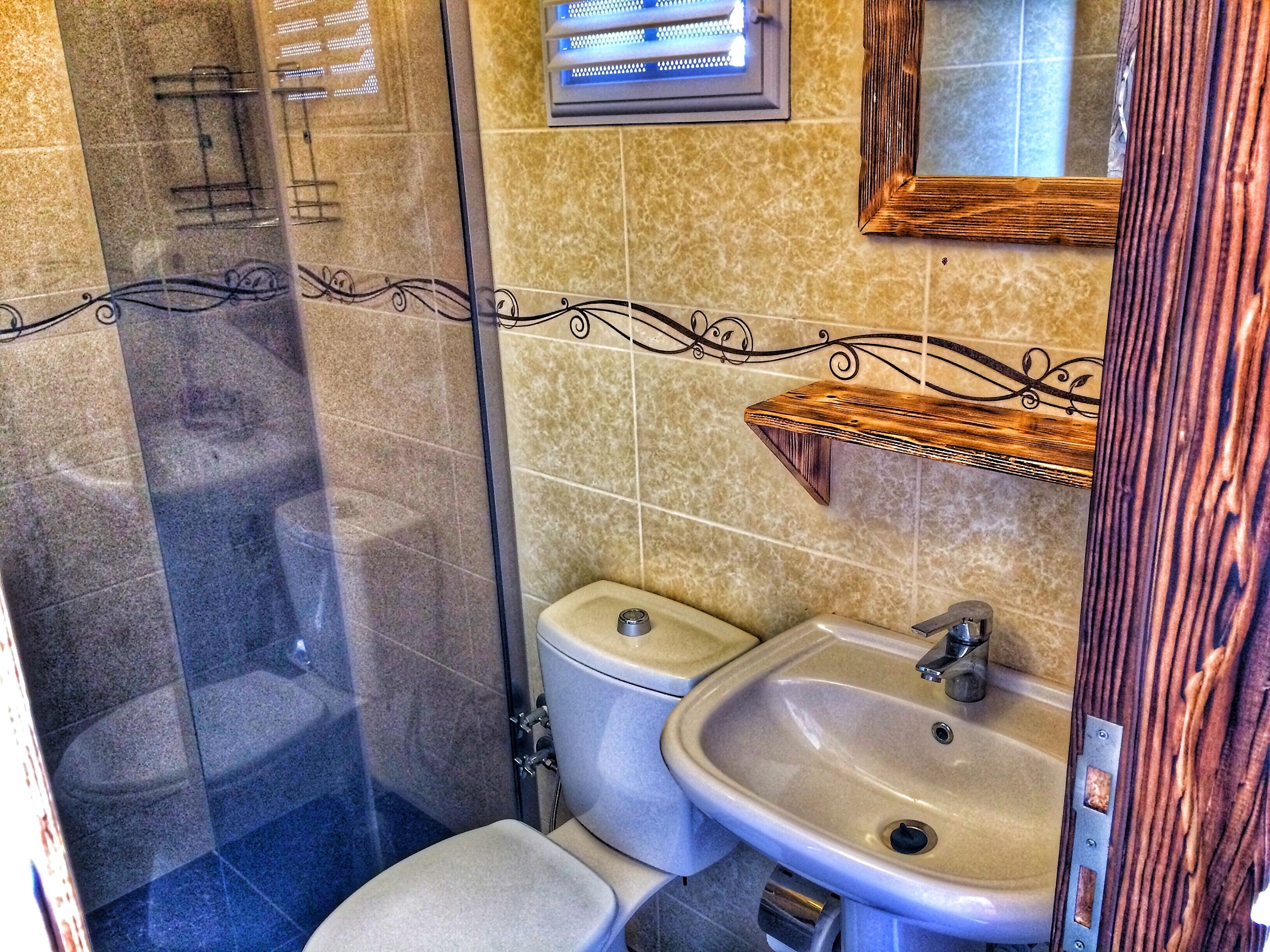 deluxe double room | bathroom | shower, free toiletries, hair dryer, slippers