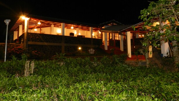 A building with multiple levels, outdoor lighting, and a garden area. - Eeescart Family Resort (Bandarawela)