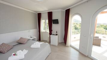 Deluxe Double Room, Terrace, Sea View | Premium bedding, minibar, in-room safe, individually decorated
