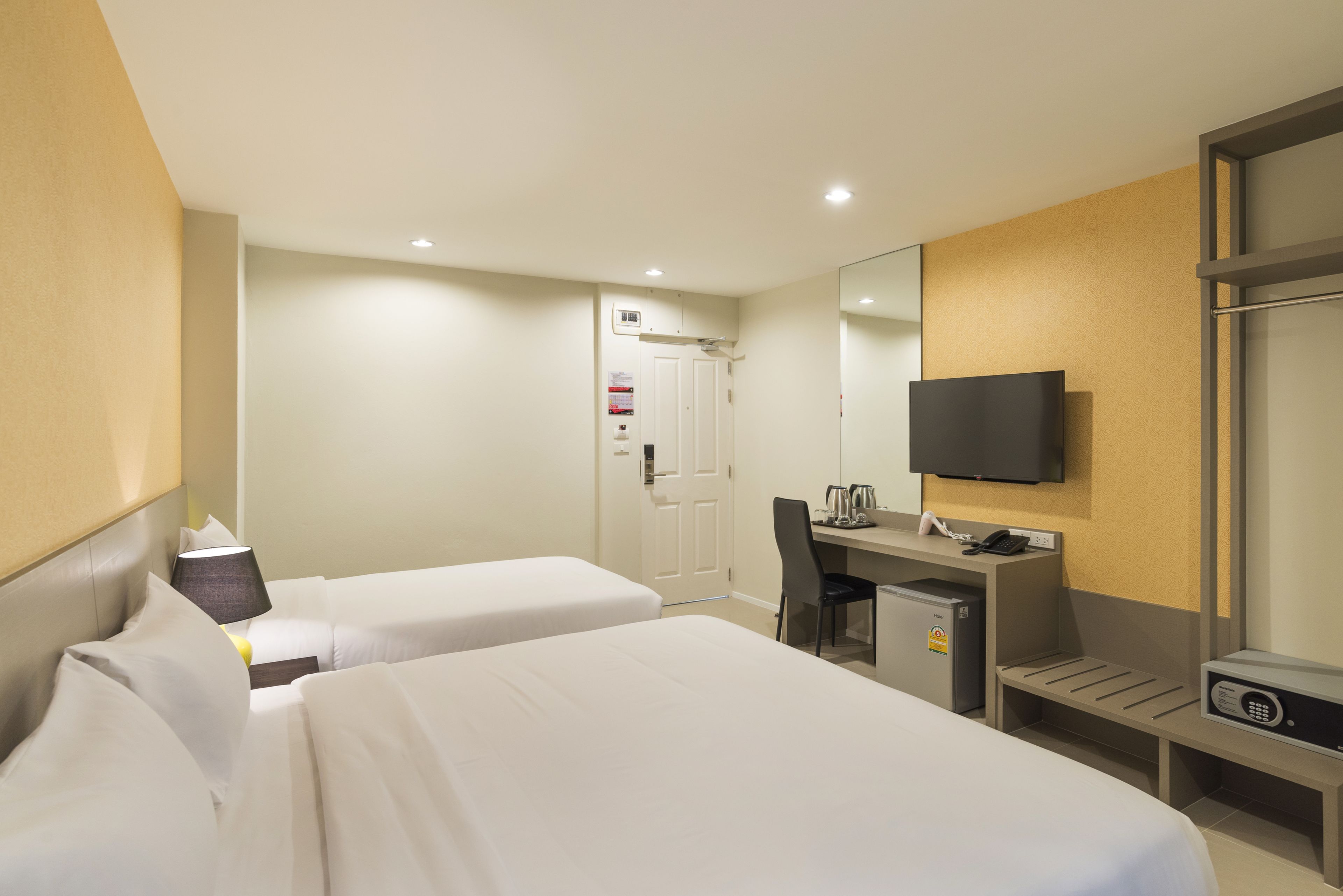 family room | minibar, in-room safe, desk, blackout curtains