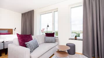 Superior Studio | Living area | Flat-screen TV