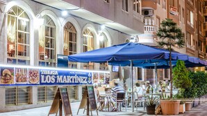 A restaurant named "Terraza Los Martinez" with outdoor seating and a blue awning. - Hotel Mediterraneo (Guardamar del Segura)