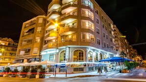A multi-story hotel with balconies, outdoor seating, and a sign for 'Hotel Los Martinez'. - Hotel Mediterraneo (Guardamar del Segura)