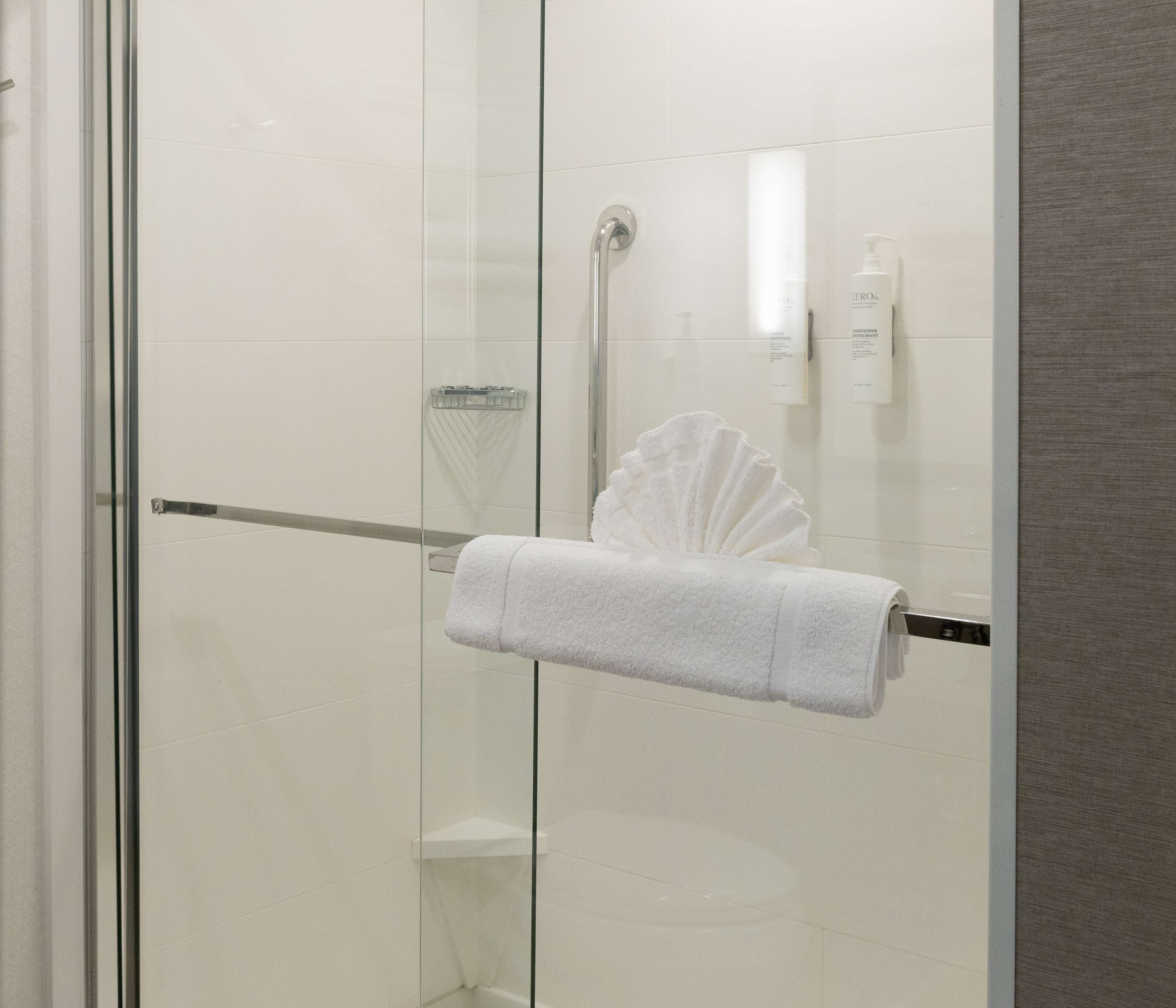 deep-soaking bathtub, rainfall showerhead, free toiletries, hair dryer