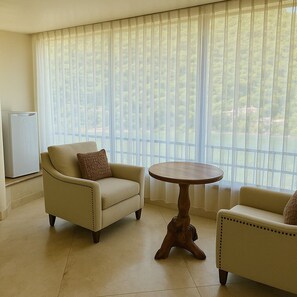 Premium Room | Living area | 60-inch Smart TV with satellite channels, Netflix, Hulu