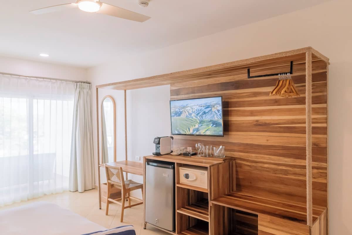 Deluxe King with Balcony Ocean View | 1 bedroom, down comforters, in-room safe, free WiFi