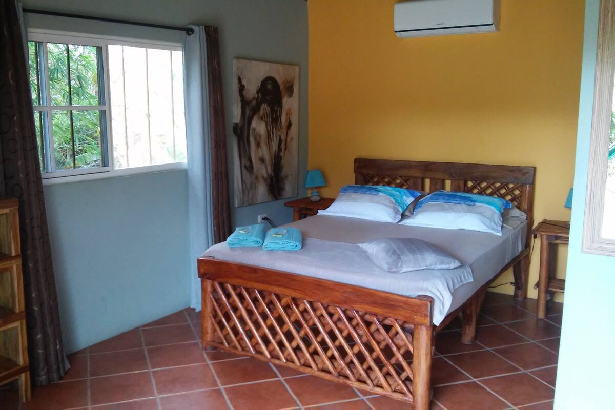 Triple Room, Garden View | Blackout drapes, cribs (free), rollaway beds (free), WiFi (free)