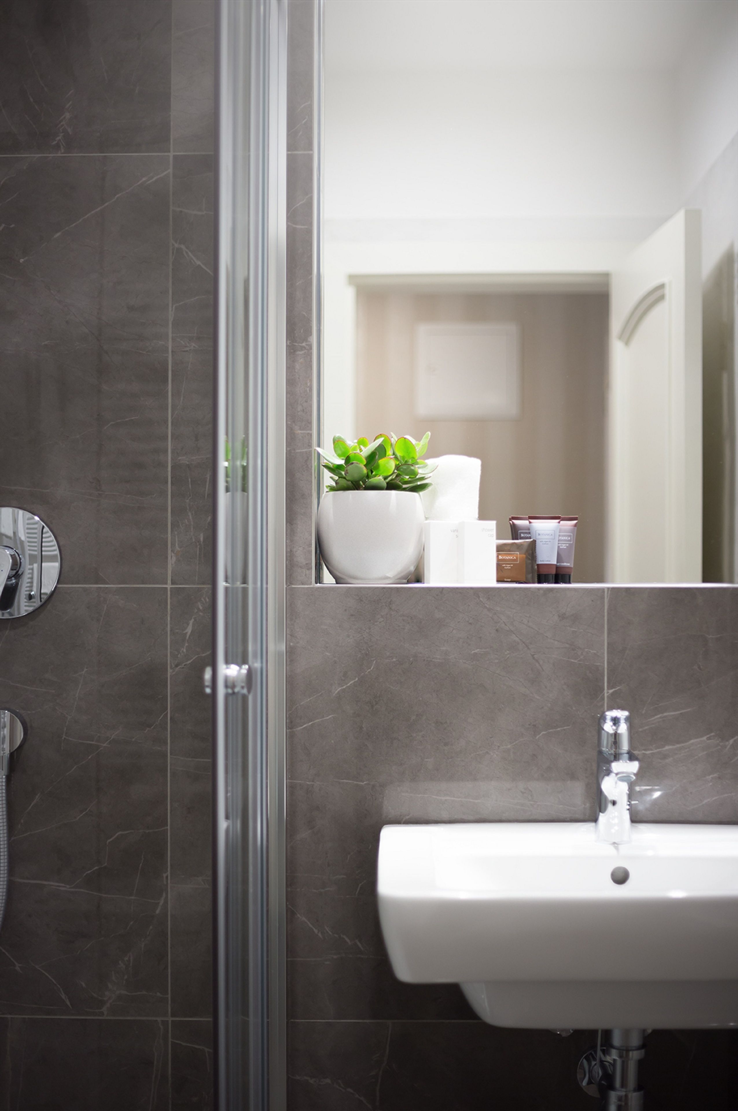 eco-friendly toiletries, hair dryer, bathrobes, slippers