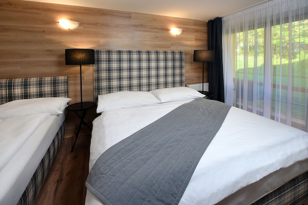 Family Apartment, Kitchenette | Desk, blackout drapes, iron/ironing board, cribs/infant beds