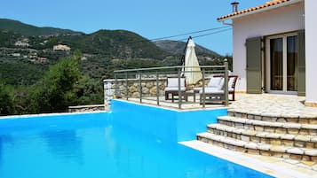 Outdoor pool, pool umbrellas, pool loungers