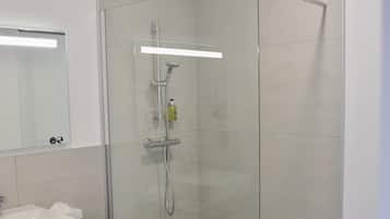 Family Apartment, 2 Bedrooms | Bathroom | Shower, free toiletries, hair dryer, towels