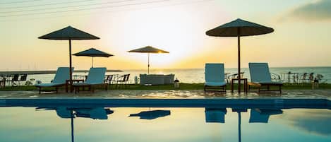 Seasonal outdoor pool, pool umbrellas, sun loungers