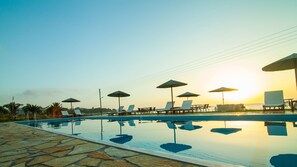 Seasonal outdoor pool, pool umbrellas, sun loungers