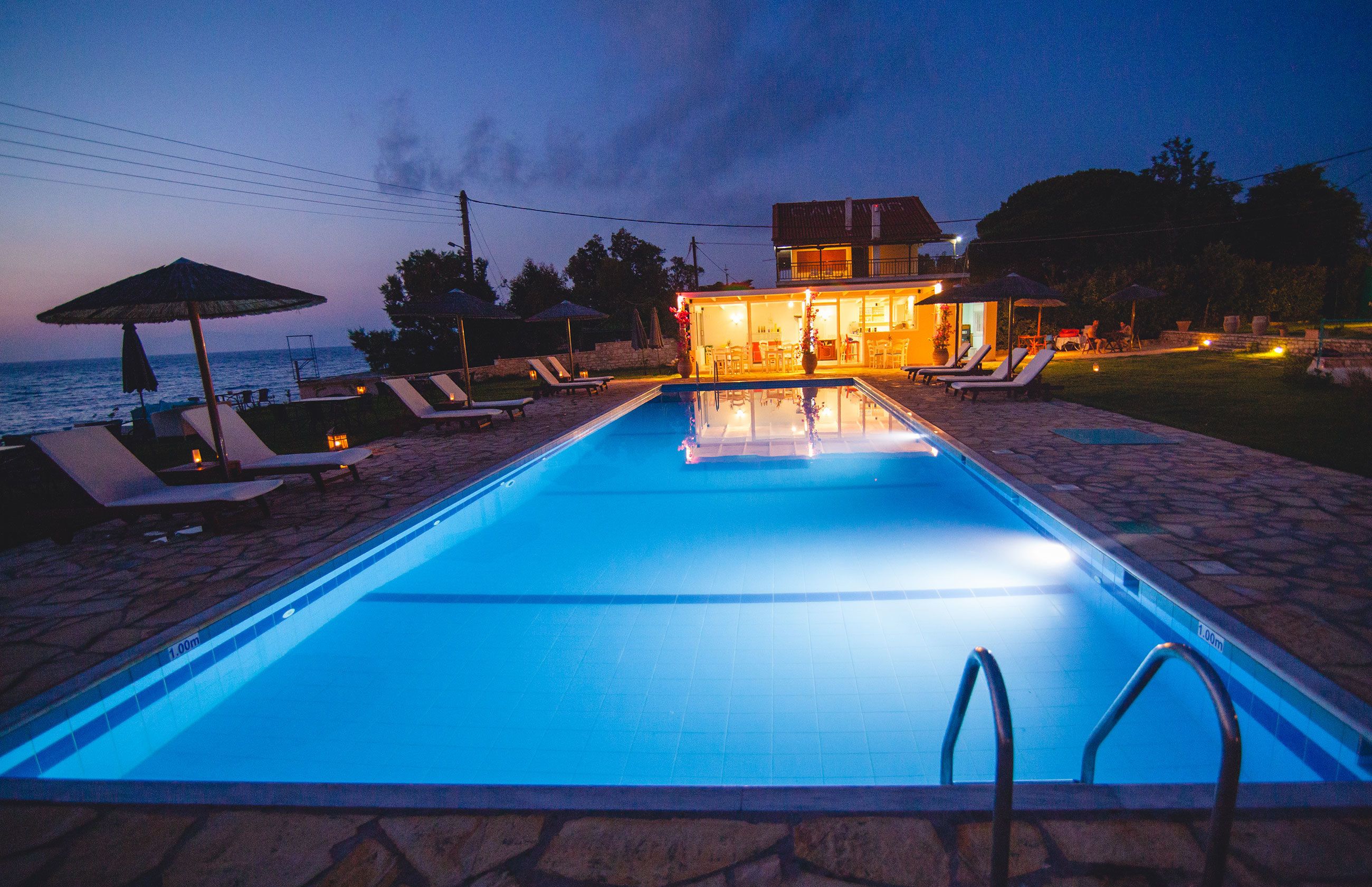 seasonal outdoor pool, pool umbrellas, pool loungers