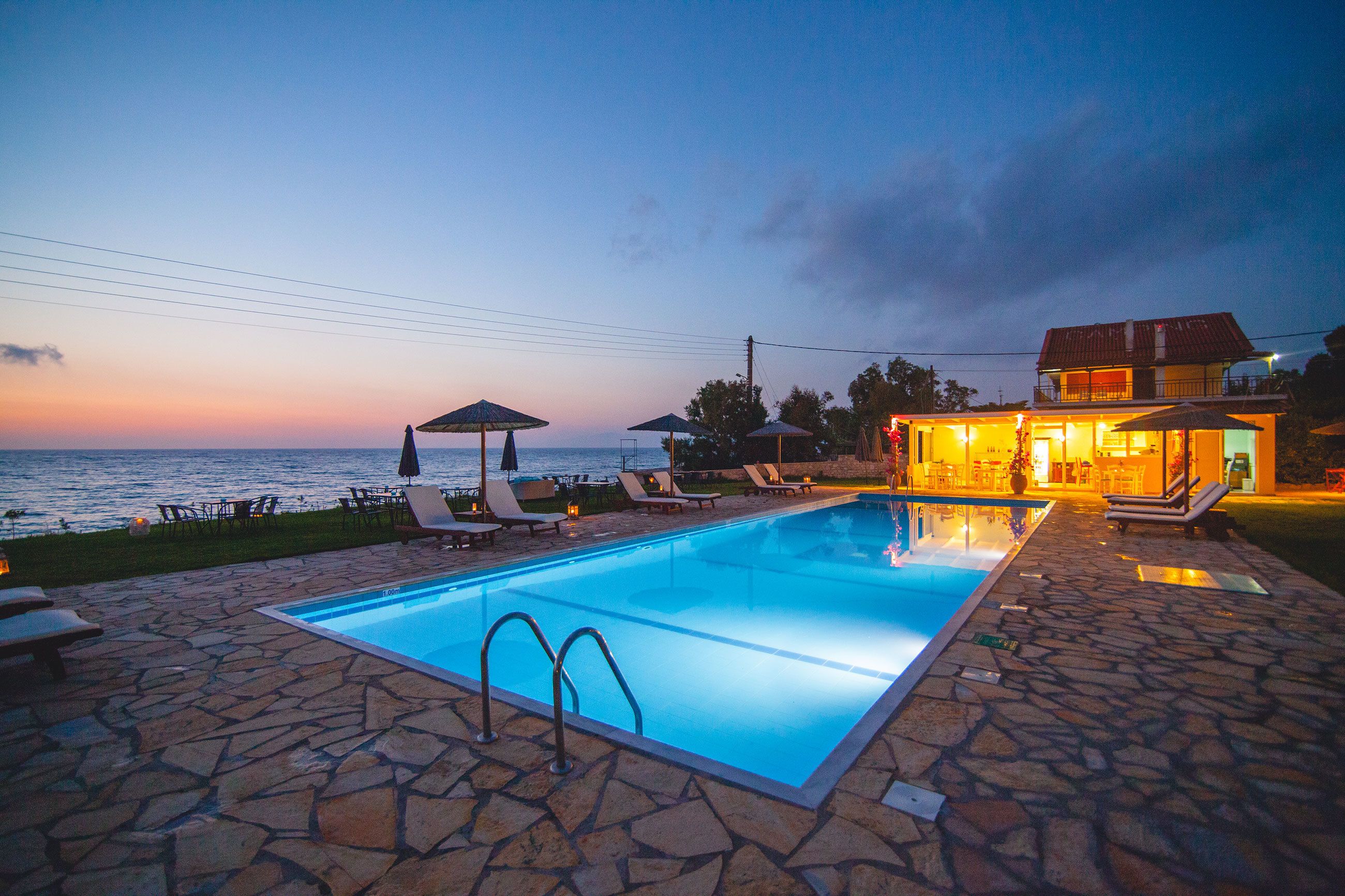 seasonal outdoor pool, pool umbrellas, pool loungers