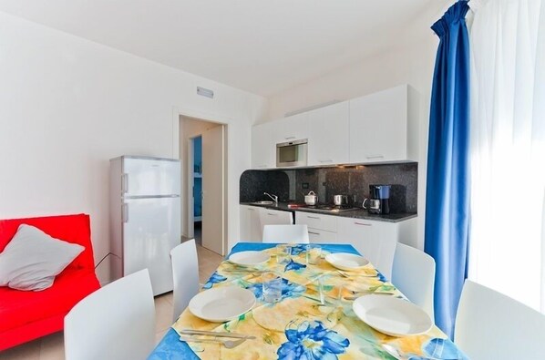 Apartment, 1 Bedroom | Living area | Flat-screen TV