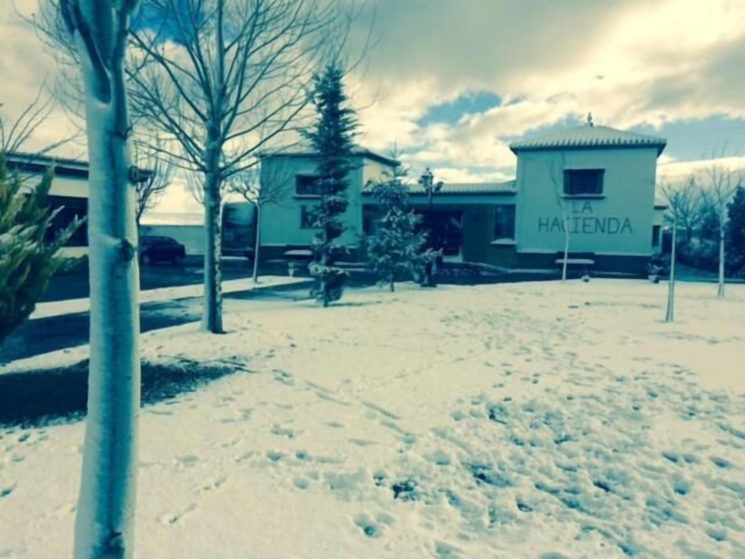 A snow-covered outdoor area with a building labeled "LA HAIENDA".
